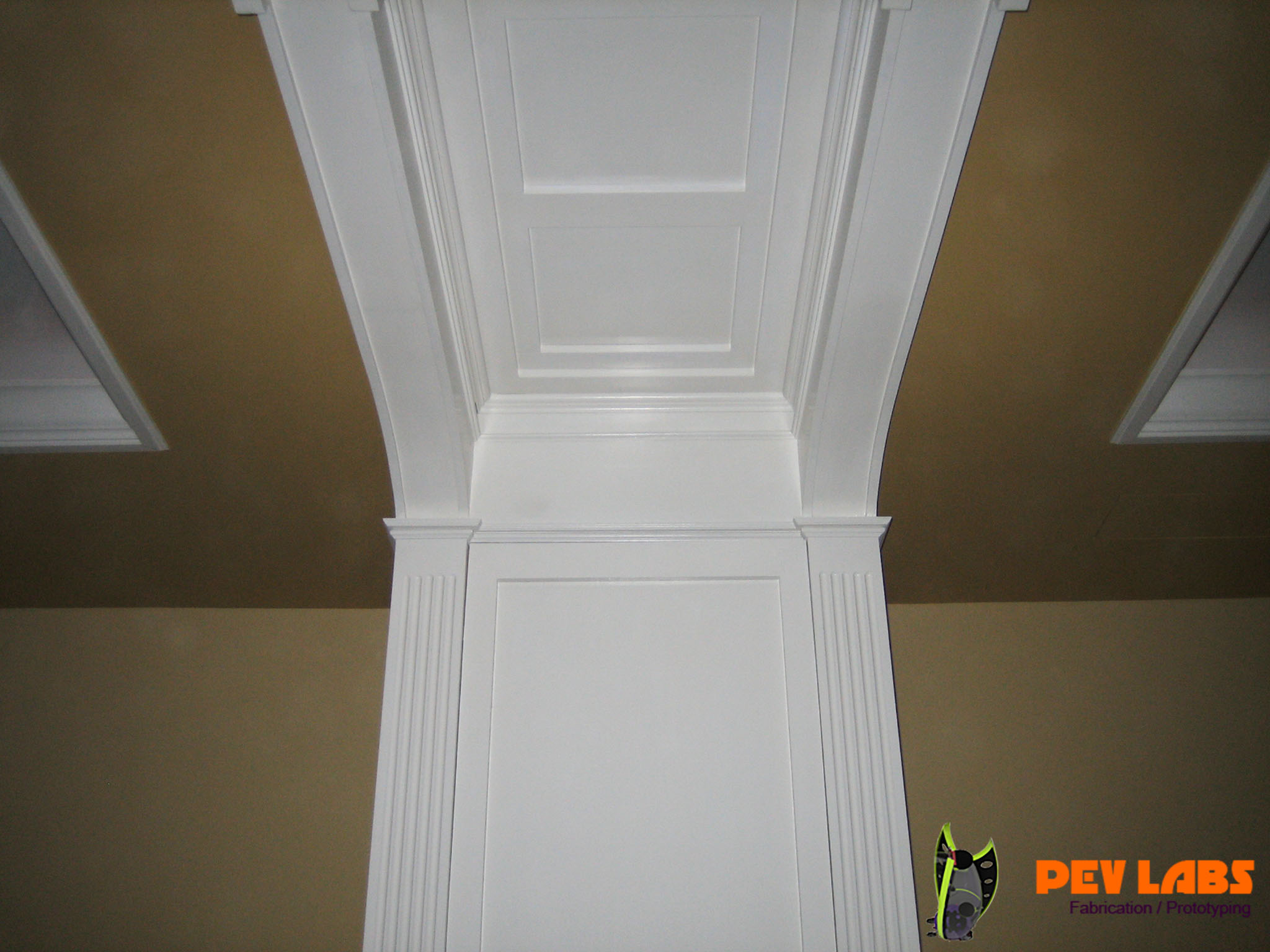 Hidden Cabinetry in Archway Panels and Ceiling Panel